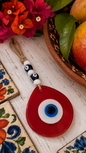 Jumbo pink hand blown glass evil eye wall hanging with beads
